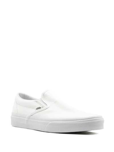 Shop Vans Classic Slip-on "true White" Sneakers