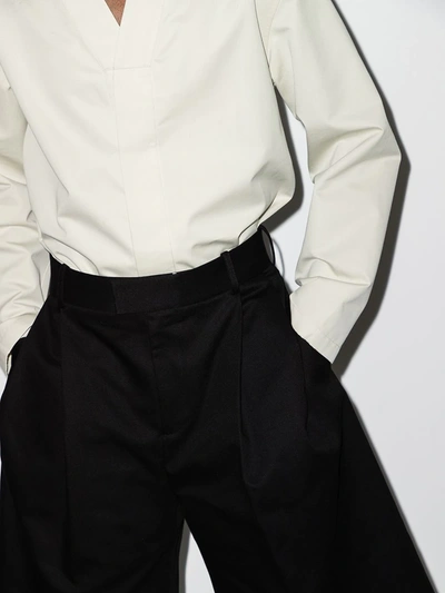 Shop Bottega Veneta Over-the-knee Tailored Shorts In Black