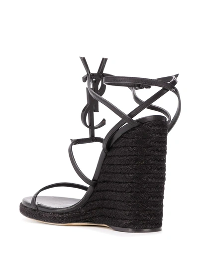 Shop Saint Laurent Cassandra 115mm Wedge Sandals In Black