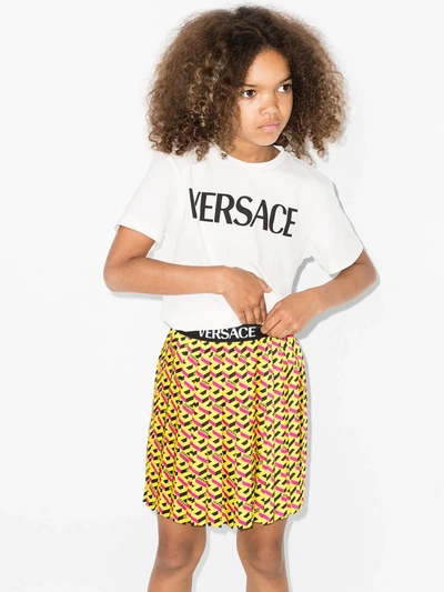 Shop Versace La Greca Print Pleated Skirt In 黄色