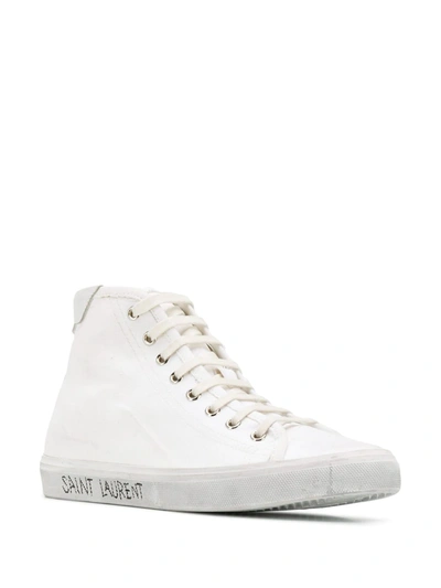 Shop Saint Laurent Distressed Canvas Sneakers In White