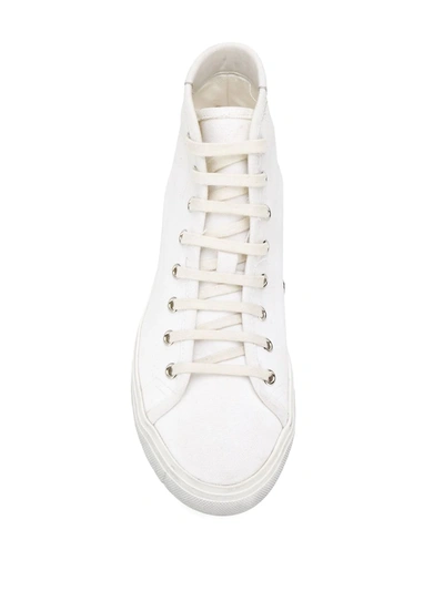 Shop Saint Laurent Distressed Canvas Sneakers In White