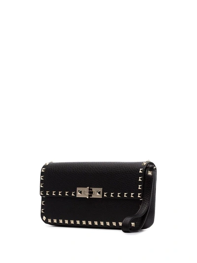 Shop Valentino Rockstud Clutch In Black