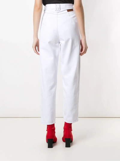 Shop Amapô Pleated Jeans In White