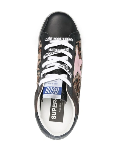 Shop Golden Goose Super-star Low-top Sneakers In Black