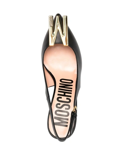 Shop Moschino M Plaque Slingback Pumps In Black