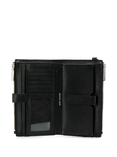Shop Michael Michael Kors Logo Plaque Wristlet Wallet In Black
