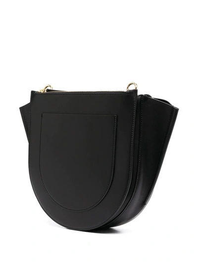 Shop Wandler Curved Leather Crossbody Bag In Black