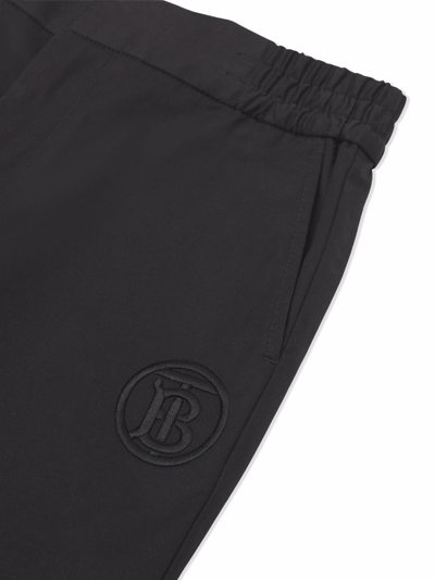 Shop Burberry Embroidered Monogram Trousers In Black