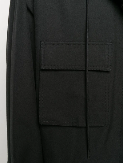 Shop Juunj Flap Pocket Drawstring Hood Coat In Black