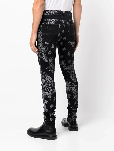 Shop Amiri Paisley-print Slim-fit Jeans In Black