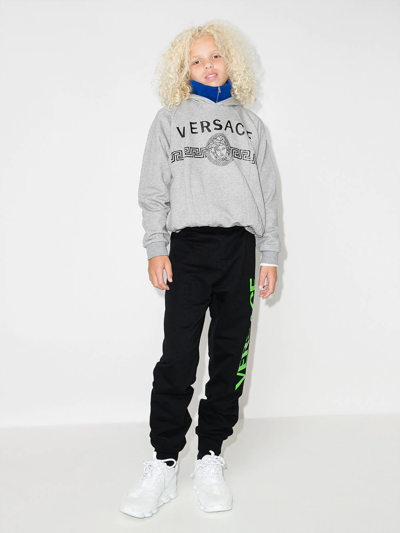 Shop Versace Logo-print Tapered Track Pants In Black