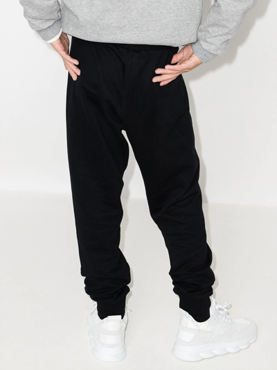 Shop Versace Logo-print Tapered Track Pants In Black