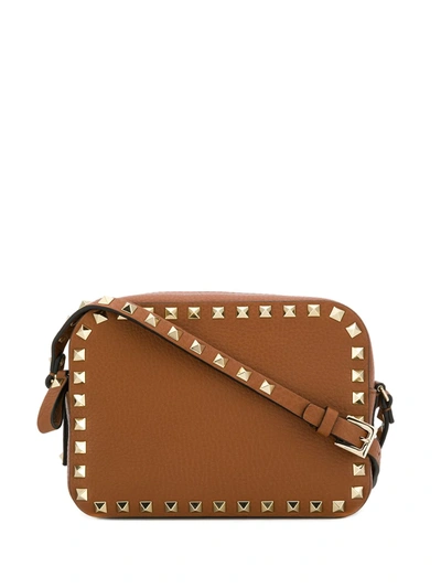Shop Valentino Rockstud Mini Bag In Brown