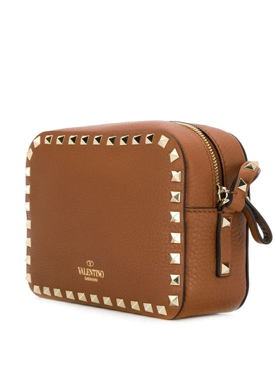 Shop Valentino Rockstud Mini Bag In Brown