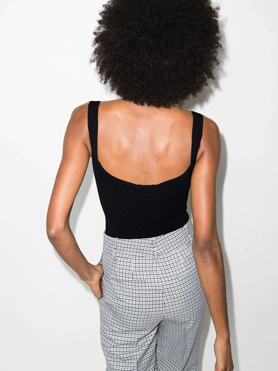 Shop Khaite The Yves Ribbed-knit Bodysuit In Black