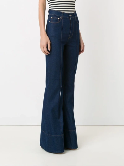 Shop Amapô High Waist Flared Jeans In Blue