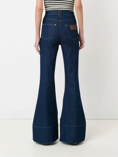 Shop Amapô High Waist Flared Jeans In Blue