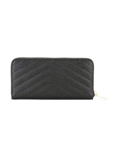 Shop Saint Laurent Monogram Zip-around Wallet In Black