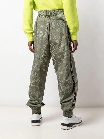 ALL OVER LOGO TRACK TROUSERS