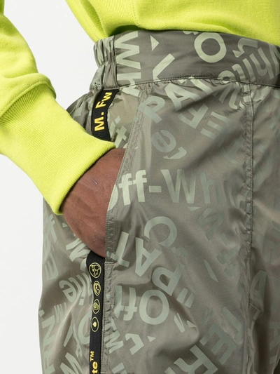 ALL OVER LOGO TRACK TROUSERS