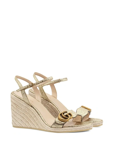 Shop Gucci Gg Buckle Wedge Sandals In Gold
