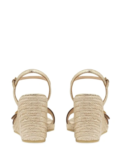 Shop Gucci Gg Buckle Wedge Sandals In Gold