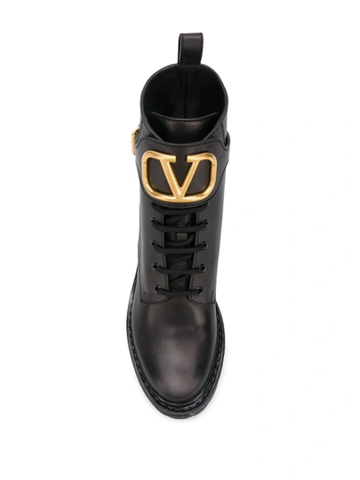 Shop Valentino Logo Appliqué Buckled Booties In Black