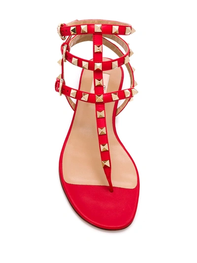 Shop Valentino Rockstud Flat Sandals In Red