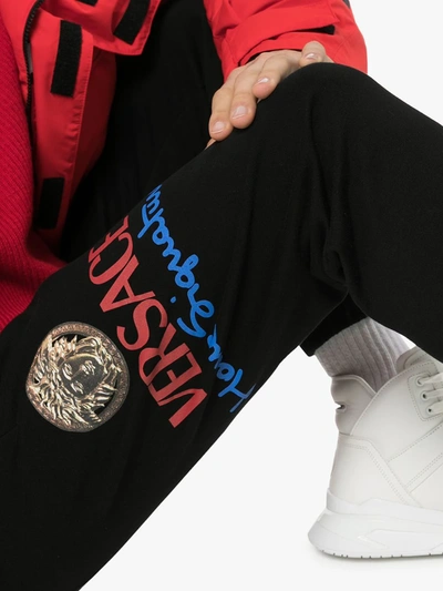 Shop Versace Logo Print Sweatpants In Black