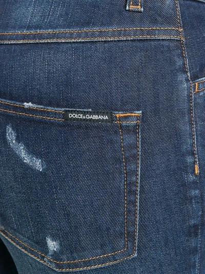 Shop Dolce & Gabbana Ripped Detail Bootcut Jeans In Blue