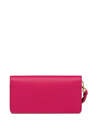Shop Prada Logo Plaque Saffiano Mini Bag In Pink