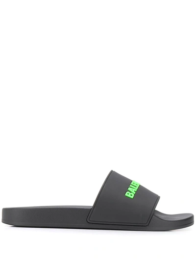 Shop Balenciaga Embossed Logo Pool Slides In Black