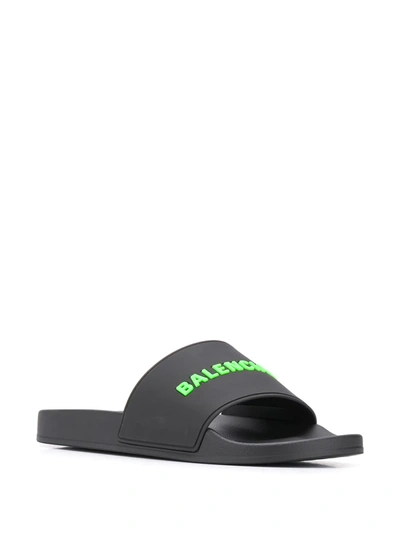 Shop Balenciaga Embossed Logo Pool Slides In Black