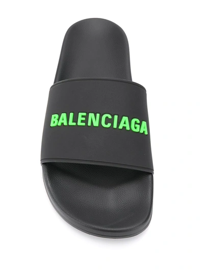 Shop Balenciaga Embossed Logo Pool Slides In Black
