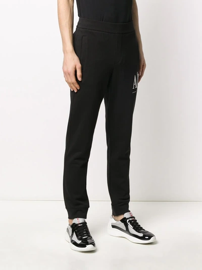 Shop Armani Exchange Logo Embroidered Track Pants In Black