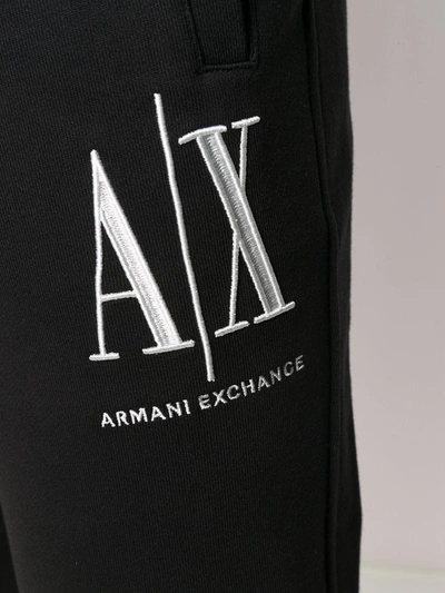 Shop Armani Exchange Logo Embroidered Track Pants In Black