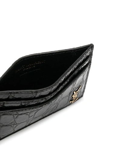 Shop Saint Laurent Tiny Monogram Crocodile-embossed Cardholder In Black