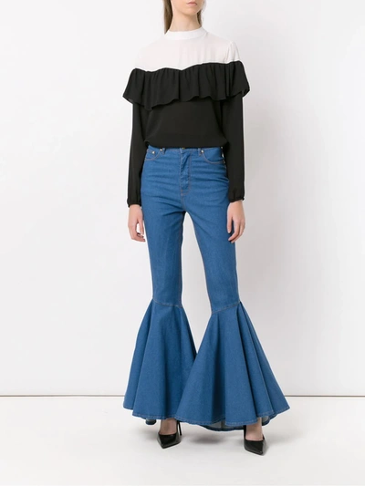 Shop Amapô Flared Jeans In Blue