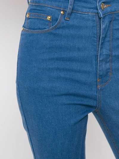 Shop Amapô Flared Jeans In Blue