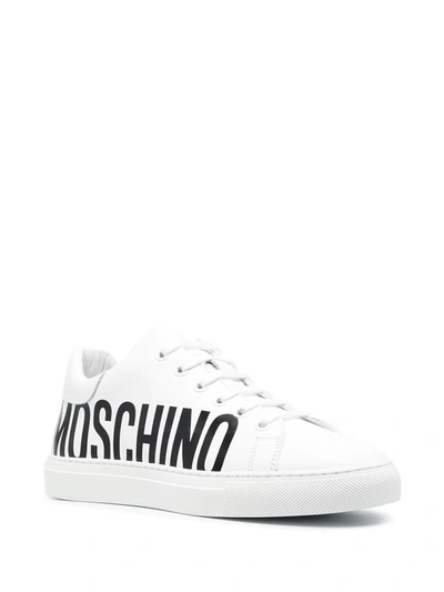 Shop Moschino Logo-print Sneakers In Bianco