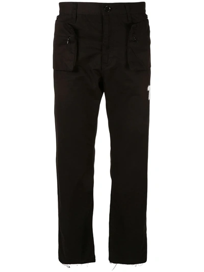Shop Undercover Zipped Pockets Trousers In Black