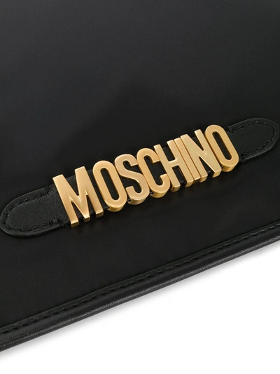 Shop Moschino Logo Zip Clutch Bag In Black