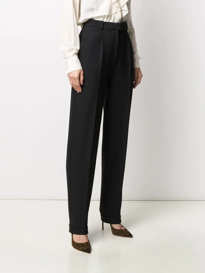 Shop Victoria Beckham Pleated Front Tapered Trousers In Black