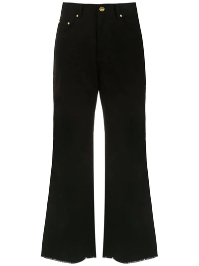 Shop Amapô Flared Jeans In Black