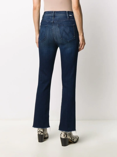 Shop Mother Boot Cut Faded Jeans In Blue