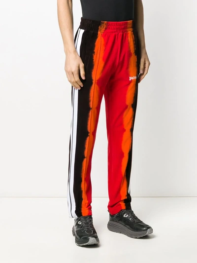 Shop Palm Angels Tie-dye Print Track Pants In Red