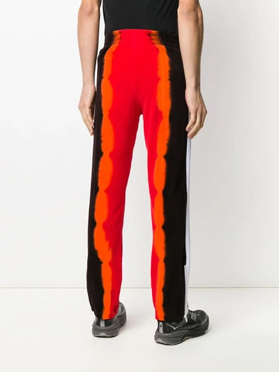 Shop Palm Angels Tie-dye Print Track Pants In Red