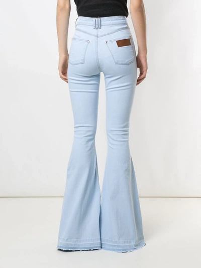 Shop Amapô Regina Super Flare Jeans In Blue