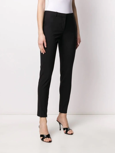 Shop Versace Skinny Tailored Trousers In Black